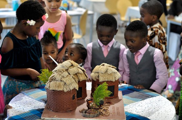 Kids around the cake